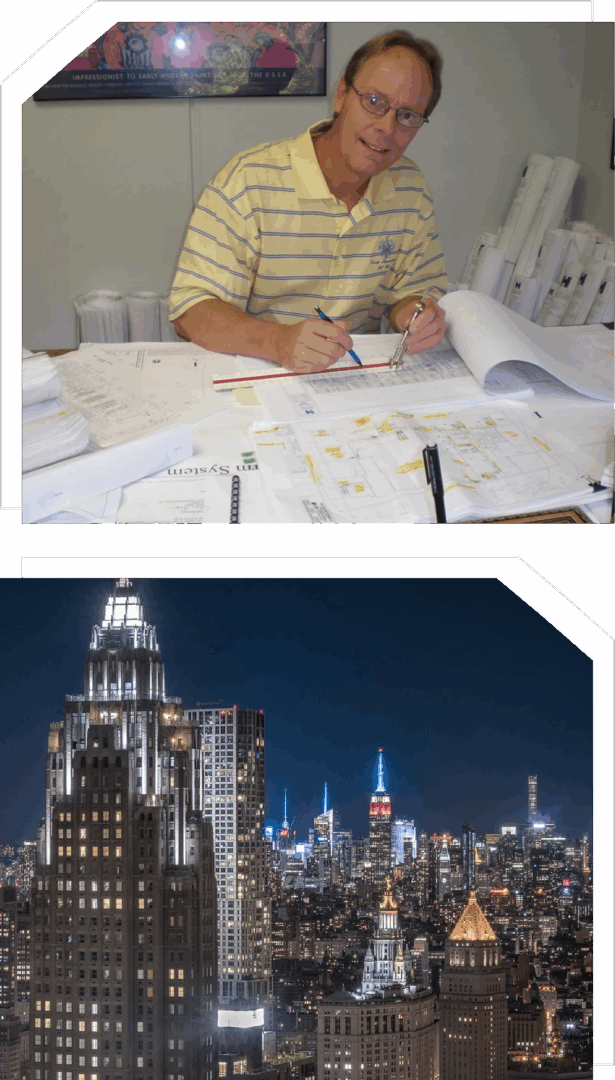 Man working at desk; Empire State Building.